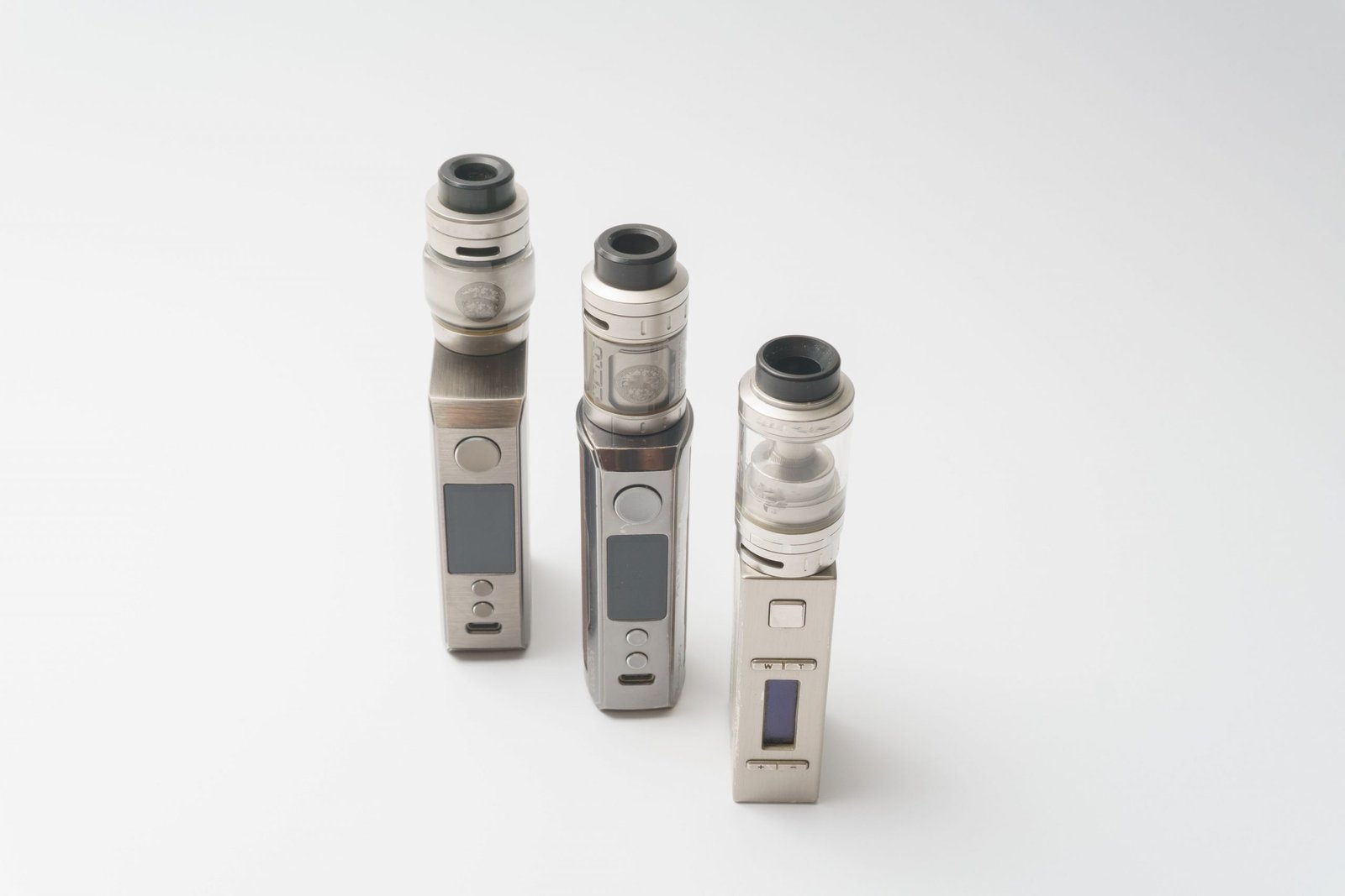 Home Three sleek vape devices displayed on a clean white background, showcasing advanced technology and design.